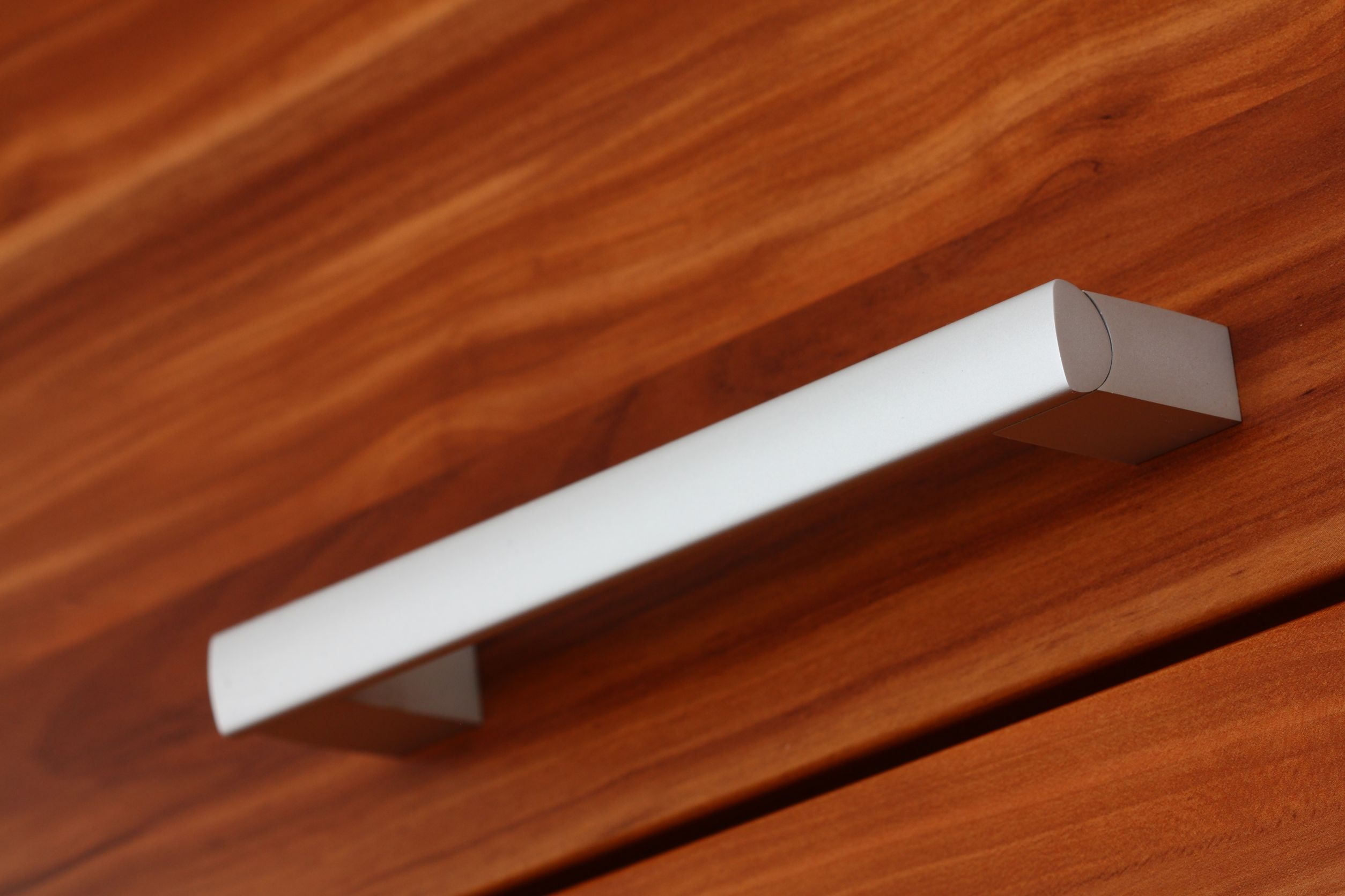 18175374 - close up of silver furniture handle on wooden drawer 18175374 - close up of silver furniture handle on wooden drawer