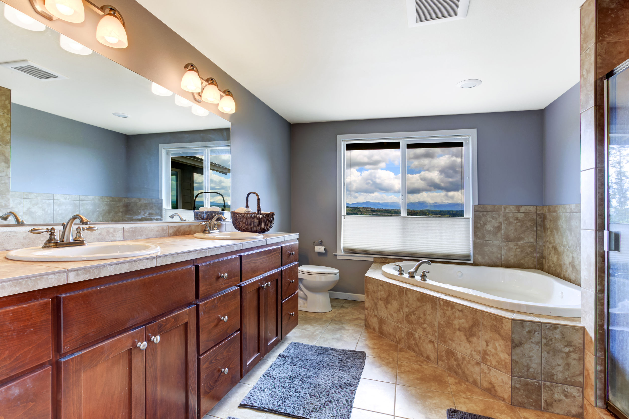 30130135_l 30130135 - lavender bathroom with brown bathroom vanity cabinet and mocha tile bath tub trim